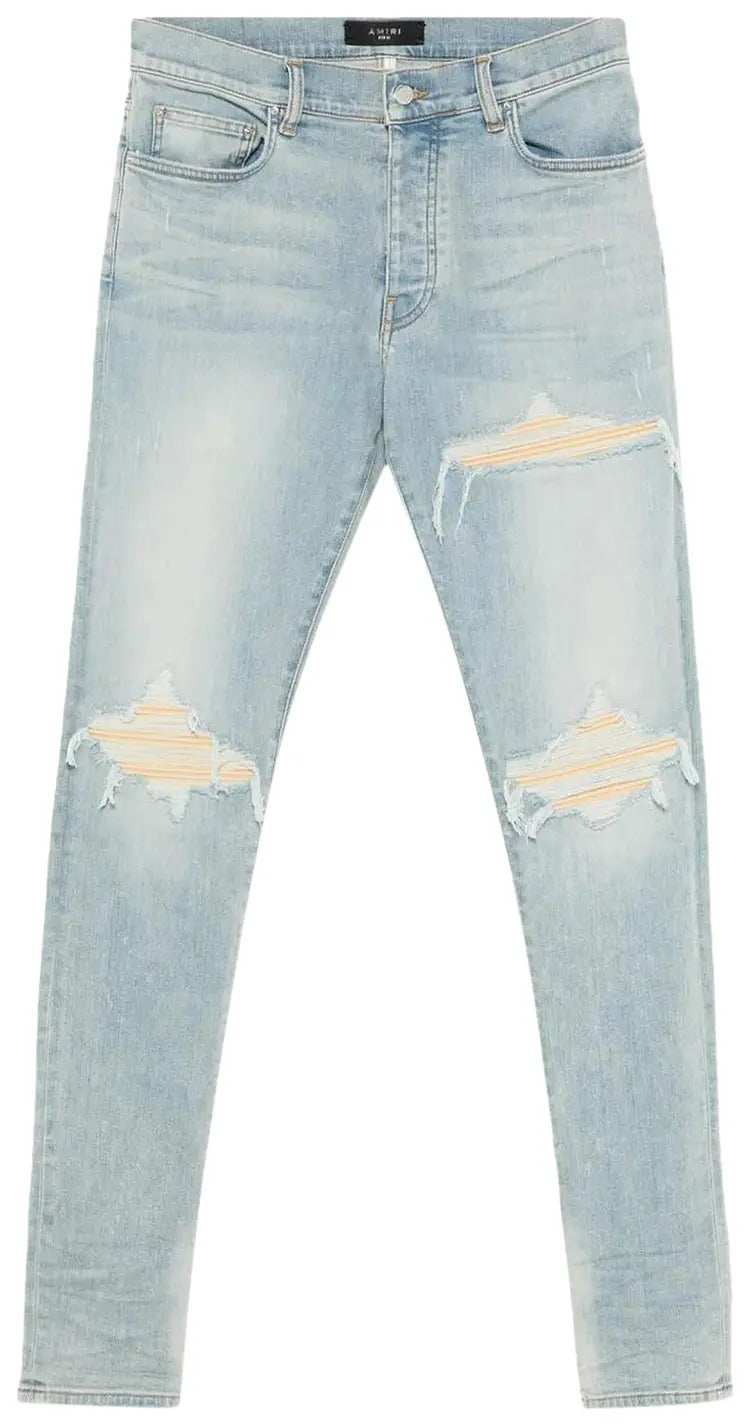 Amiri MX1 distressed jeans light blue wash yellow patch
